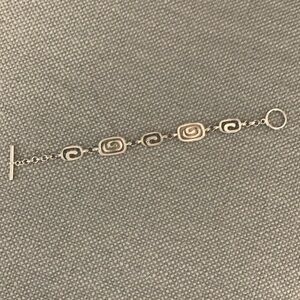 Costume bracelet… with mother of pearl in lay. Good condition.